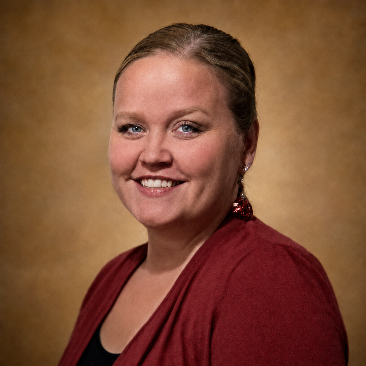 Kimberly Radle smiling in a classroom setting